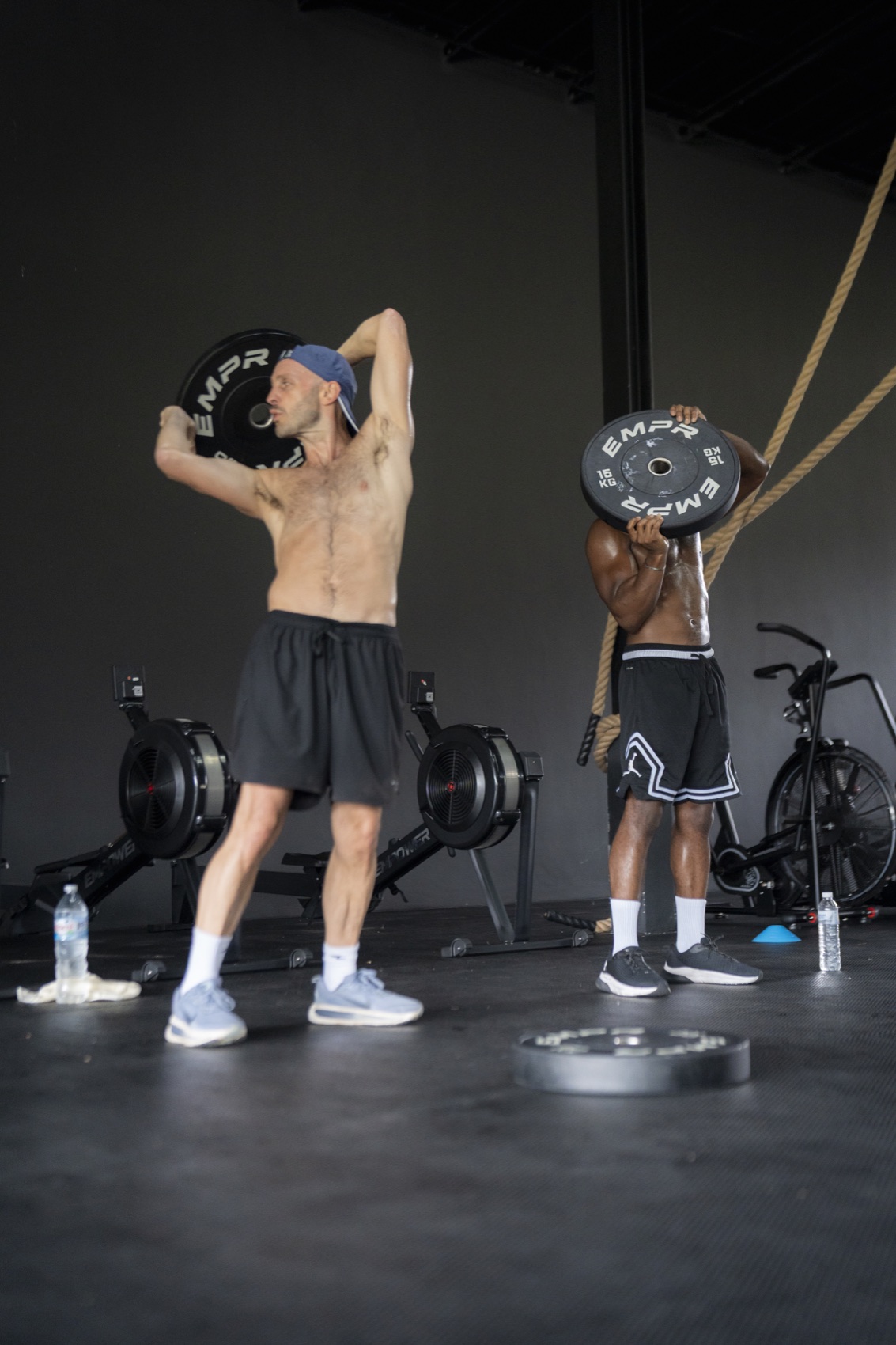 Athletes training with plates during an EMPOWER HIIT class