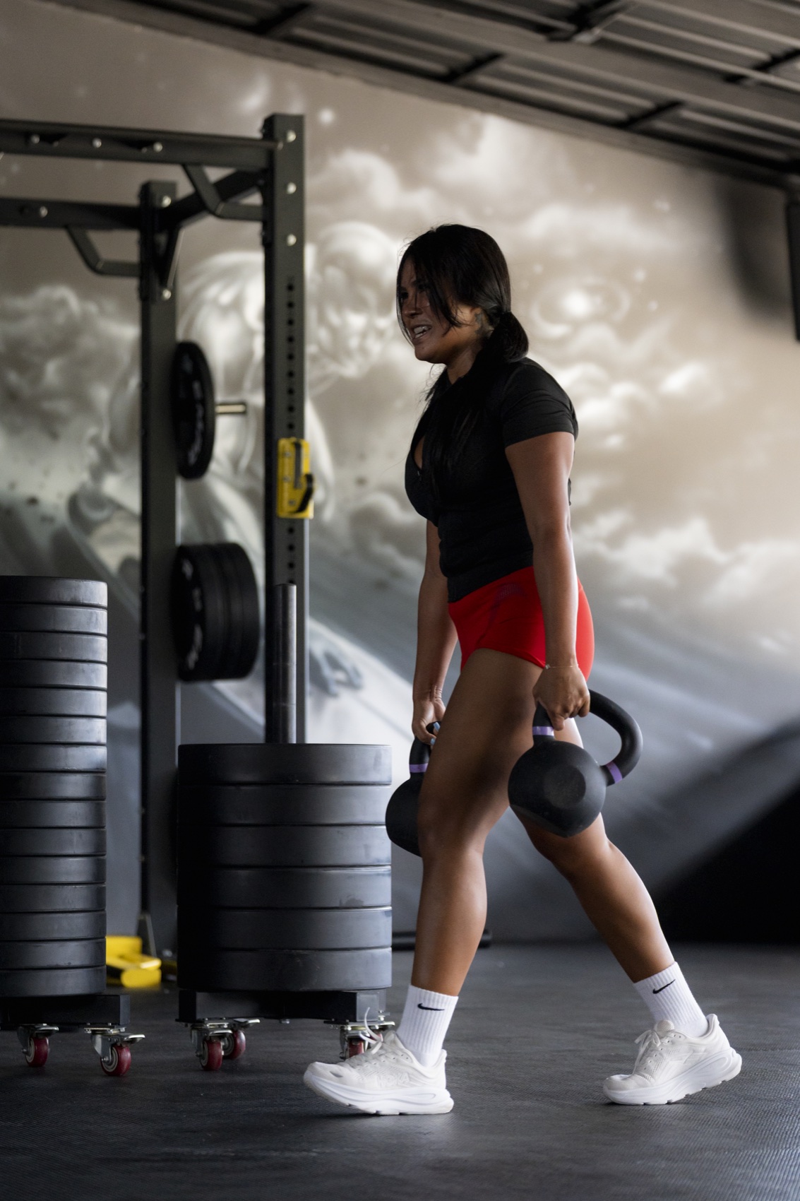Athlete carrying kettlebells during Wild Card