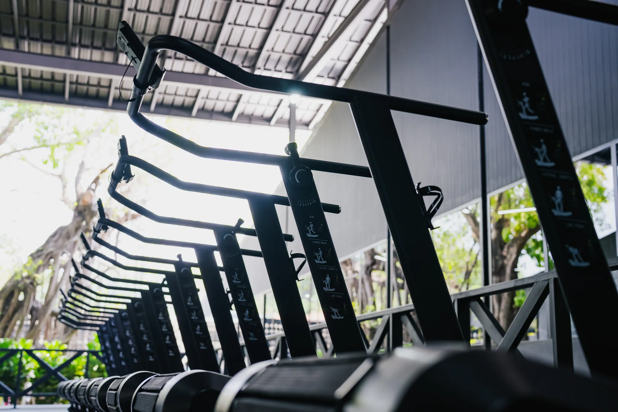 Curved manual treadmills on the EMPOWER functional fitness floor