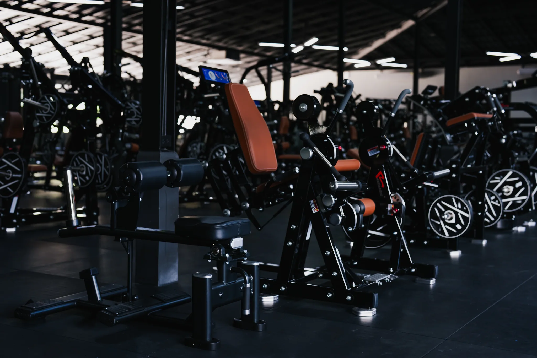 Rows of strength machines at EMPOWER Gym Kamala
