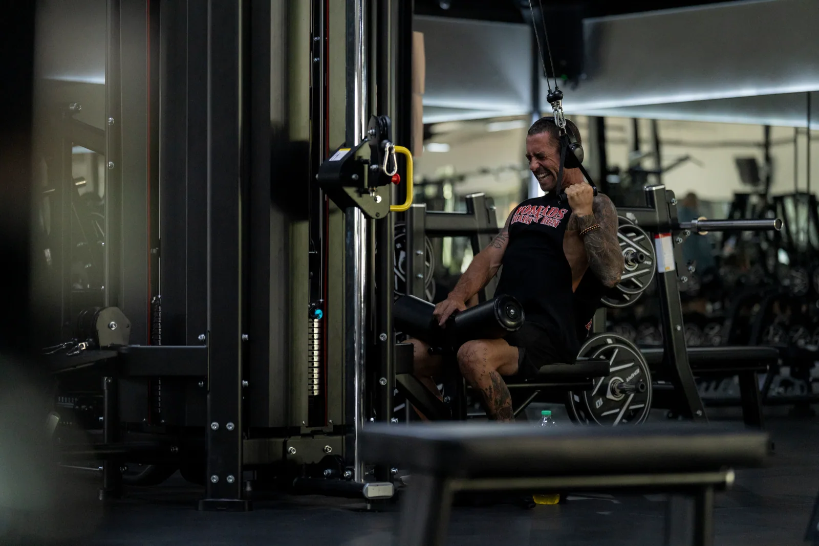 EMPOWER member training hard on a cable machine