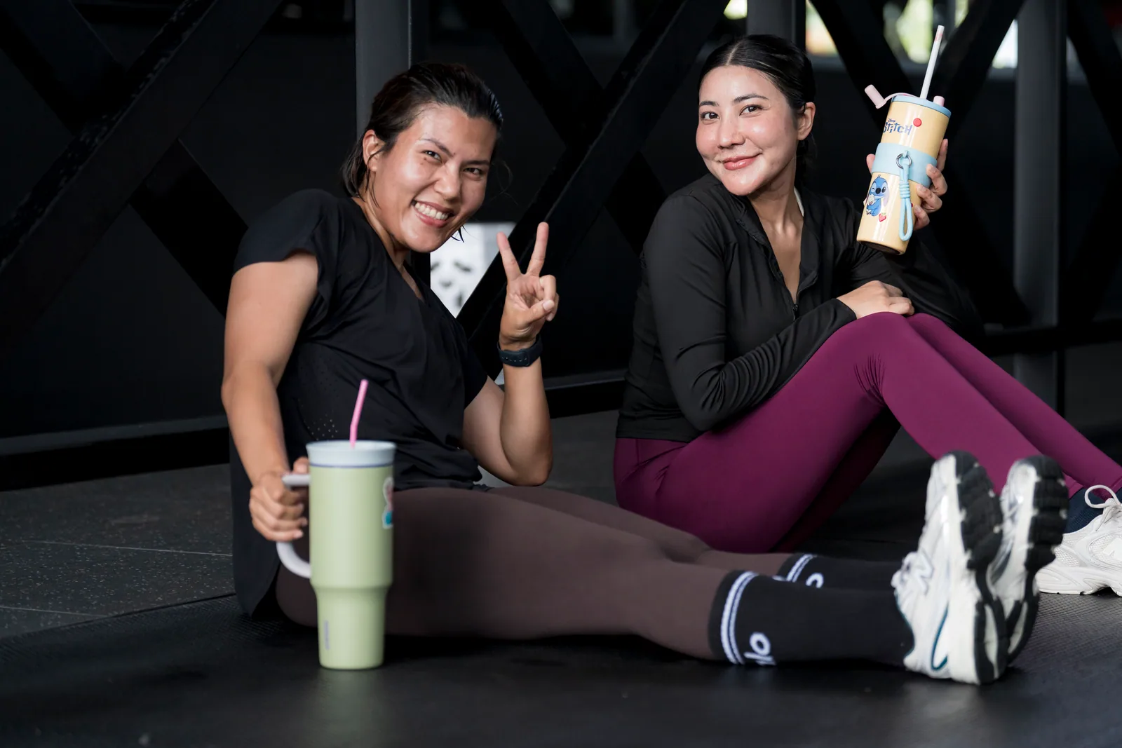 Two EMPOWER members smiling together after training