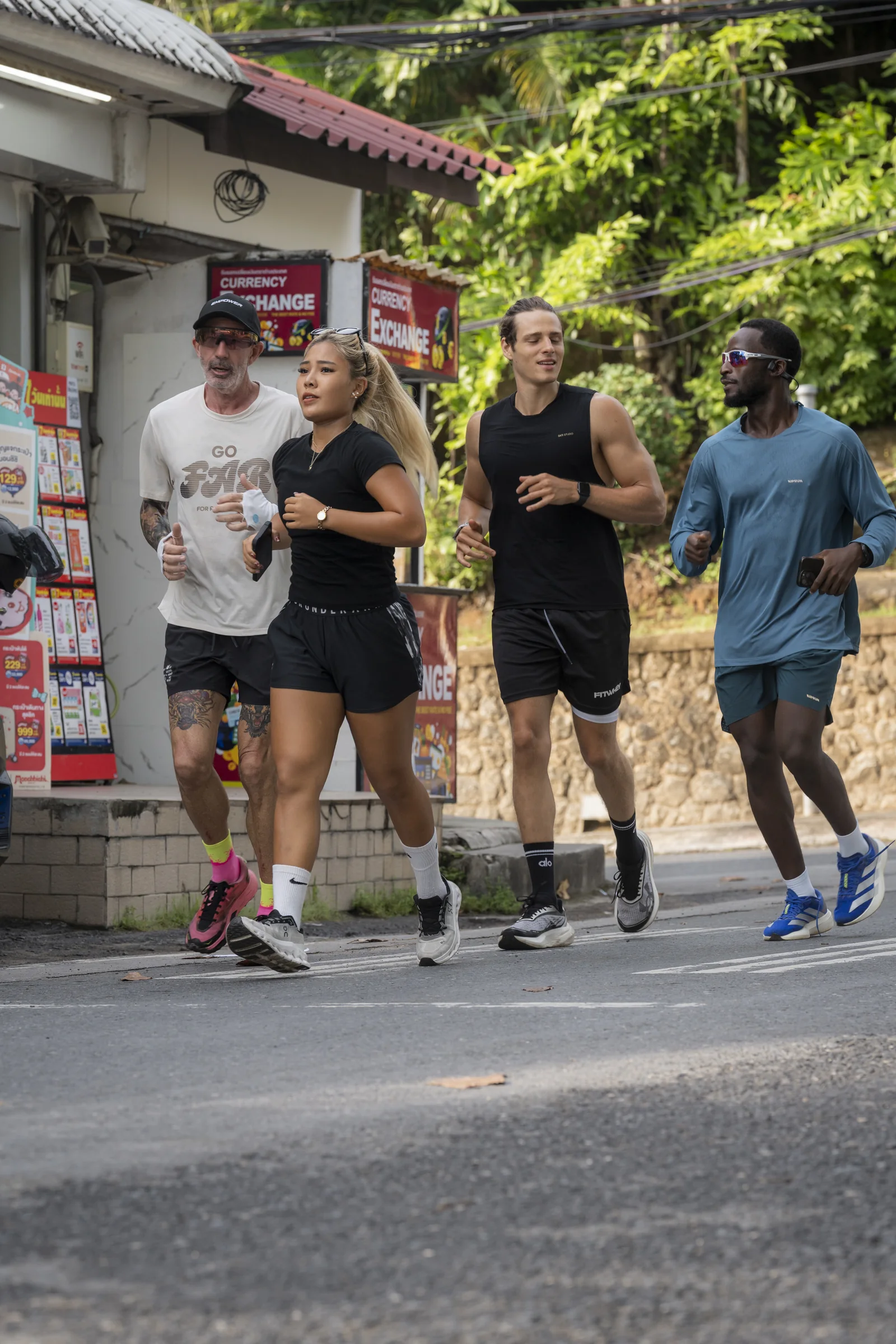 EMPOWER Run Club members running together through Kamala