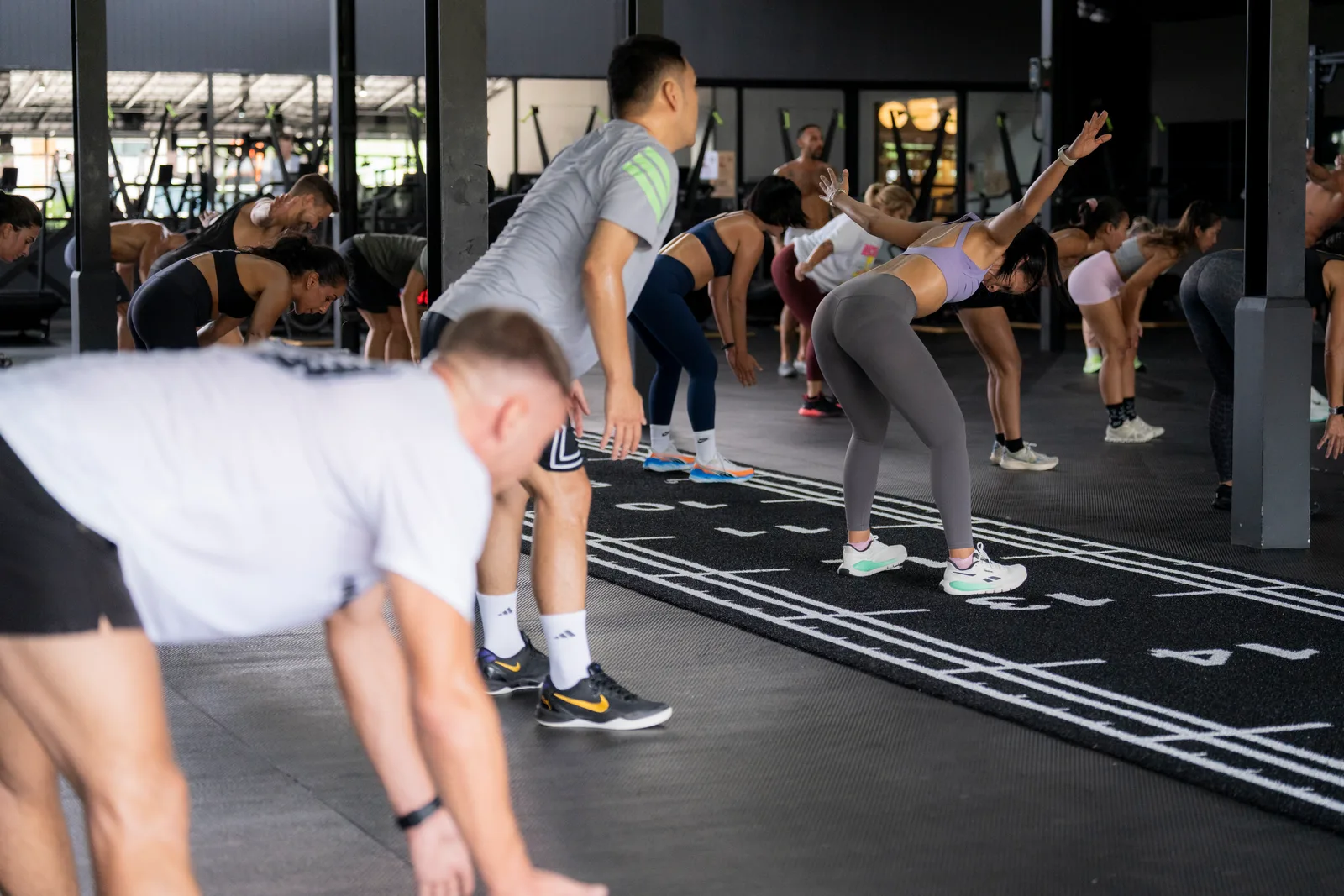 Athletes moving together through a September workout