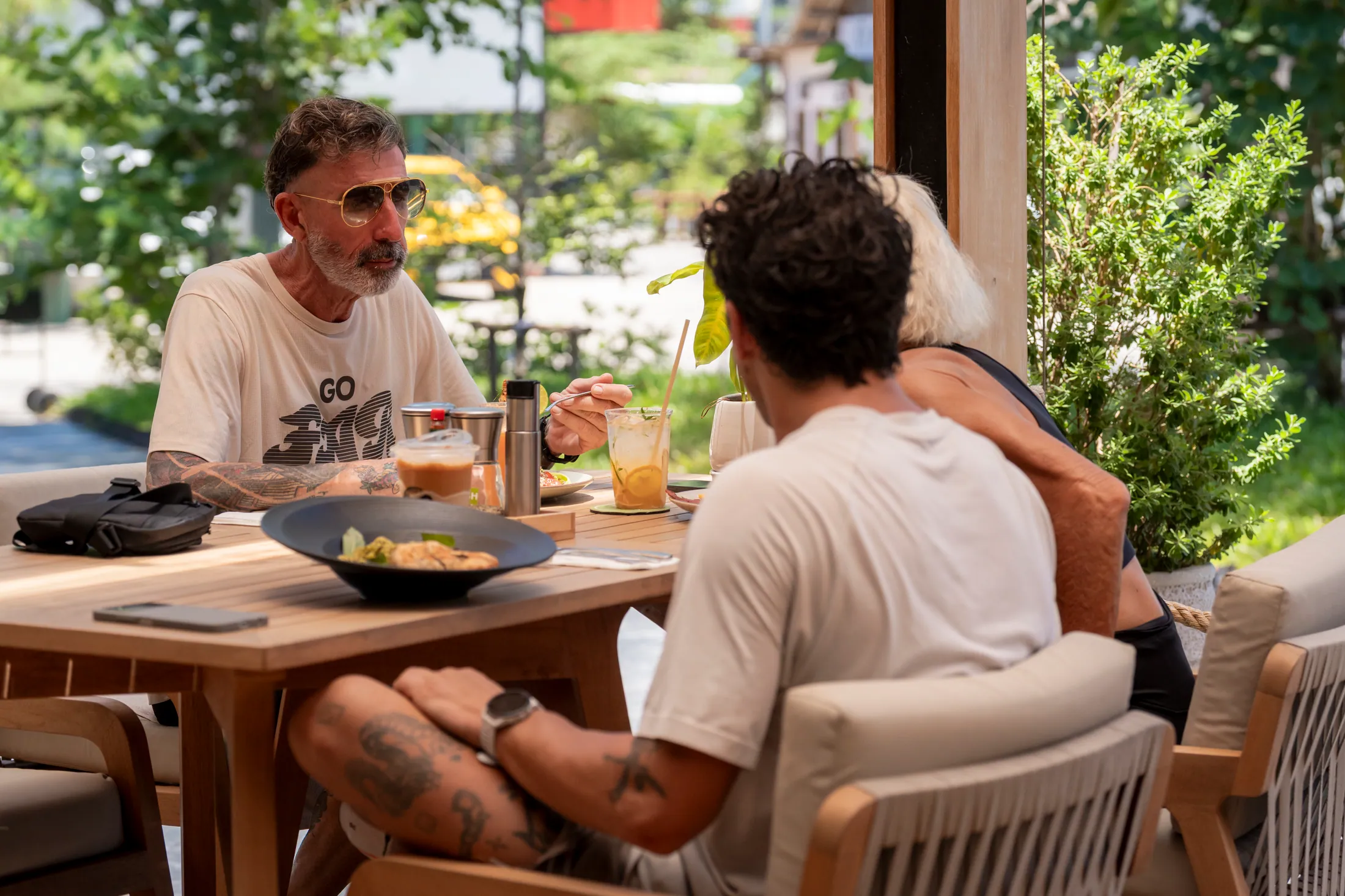 Friends dining together on the NOURISH terrace
