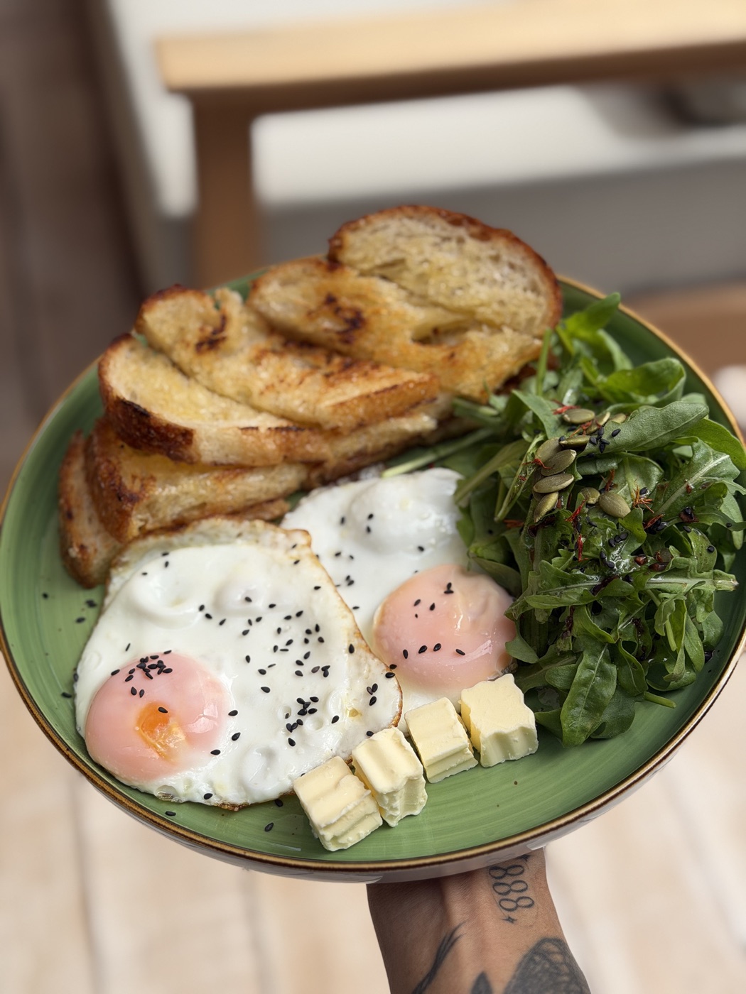 Eggs, sourdough and rocket served at NOURISH
