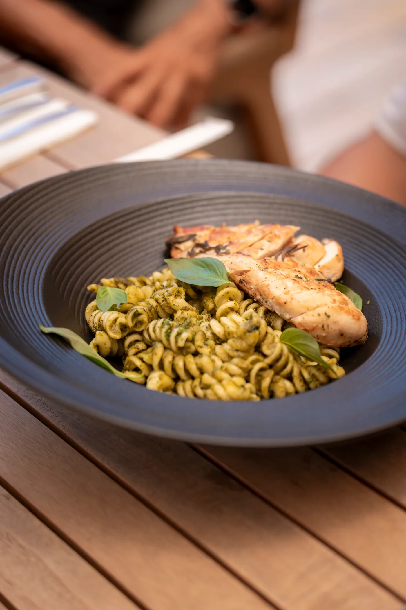 Pesto pasta with grilled chicken at NOURISH